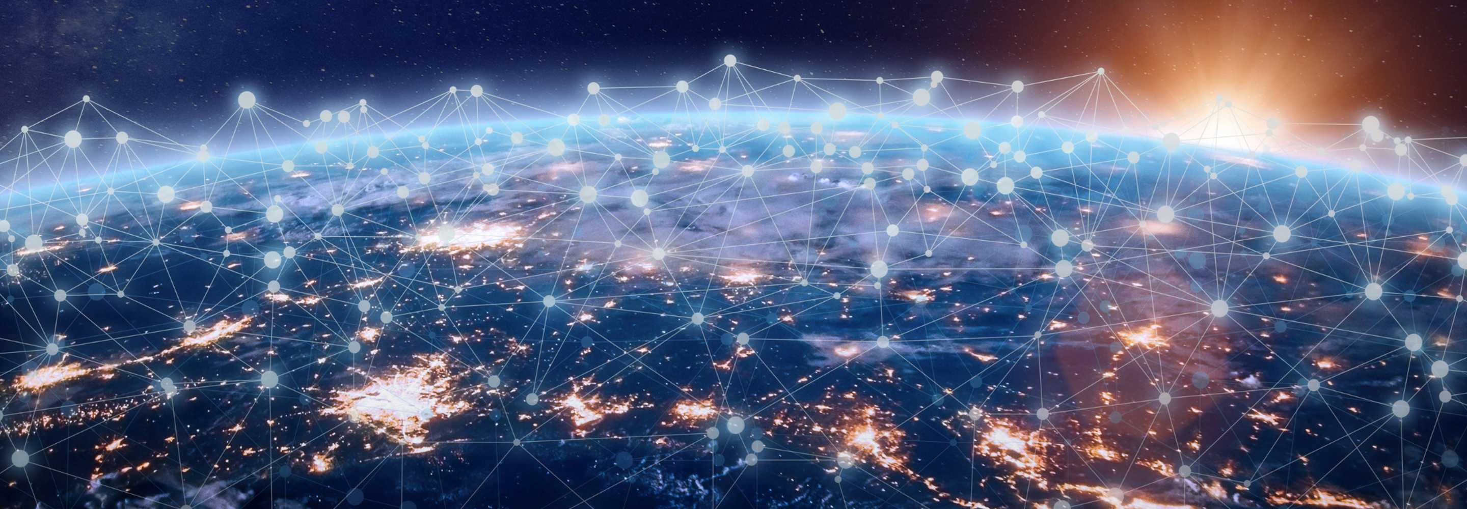 two men in building yard with hard hats, shaking hands